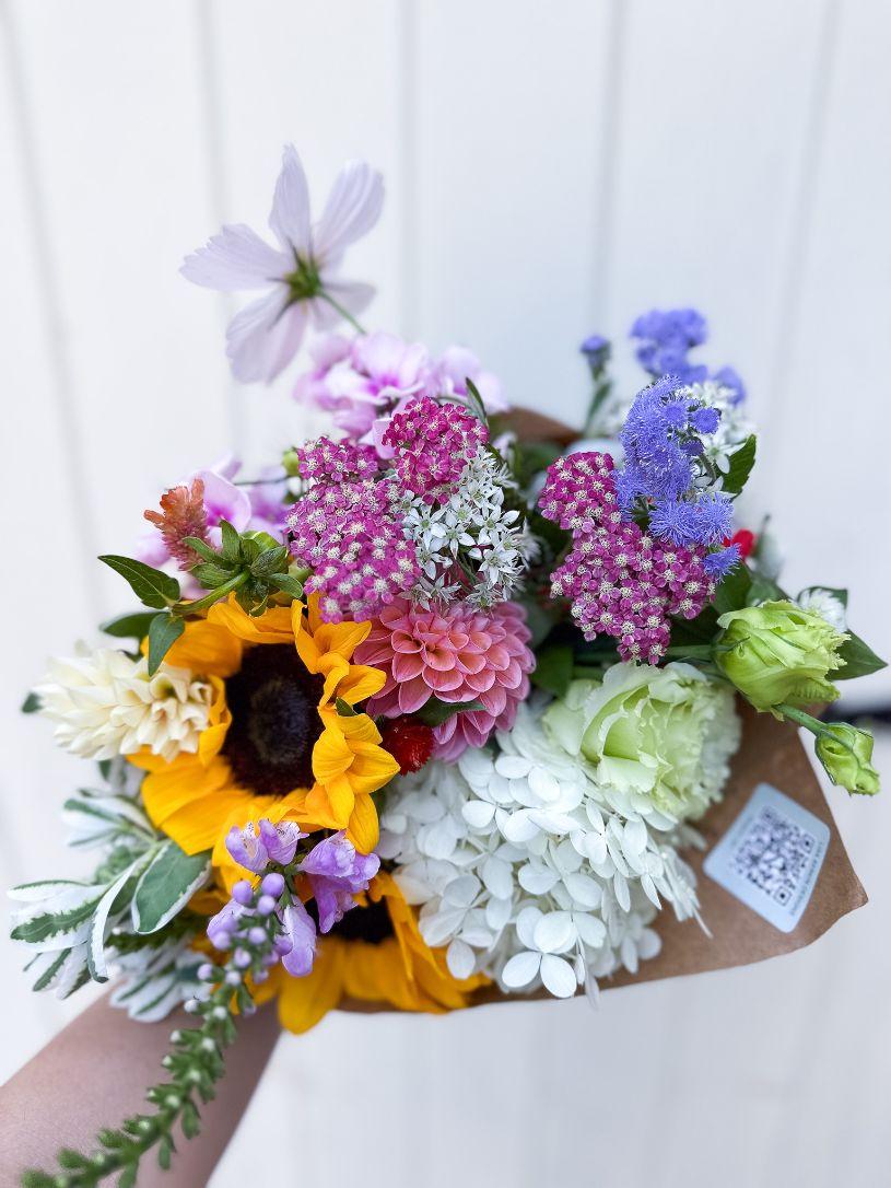 Bouquet with yarrow, sunflowers, dahlias, hydrangea.