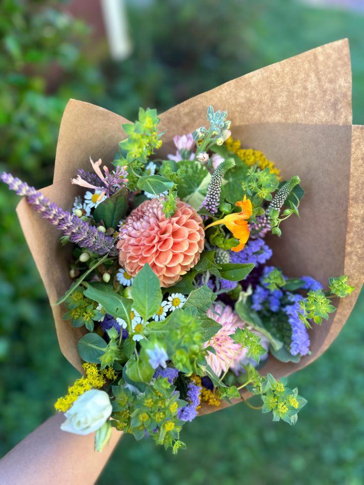 Bouquet with dahlias, greenery, and nasturtium.