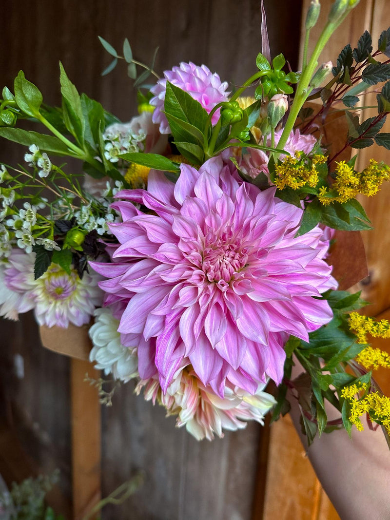 Bouquet with large pink dinnerplate dahlia.